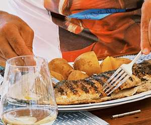 Guest enjoying fresh grilled fish
